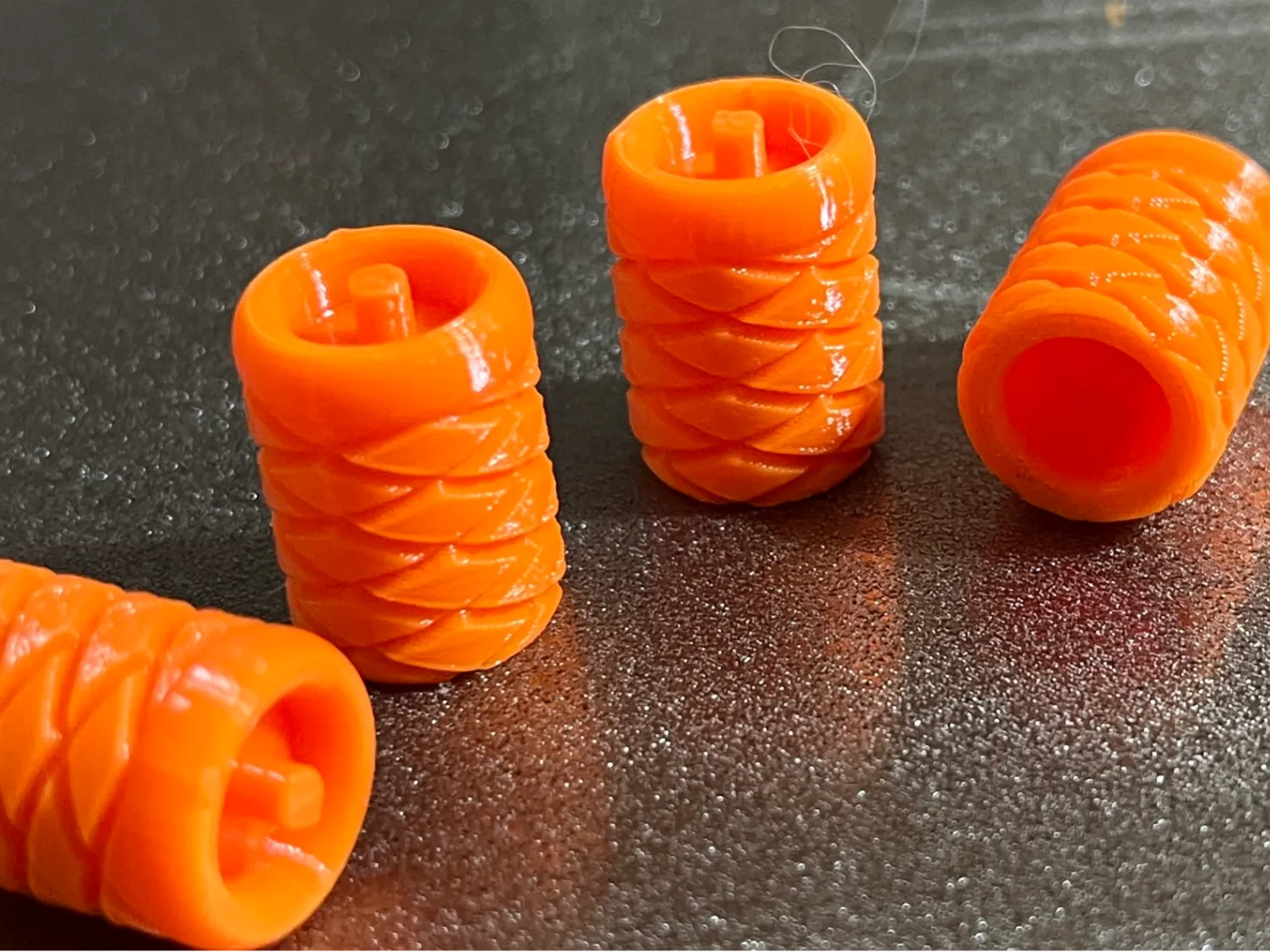 Tire valve stem cap with pressure bleed
